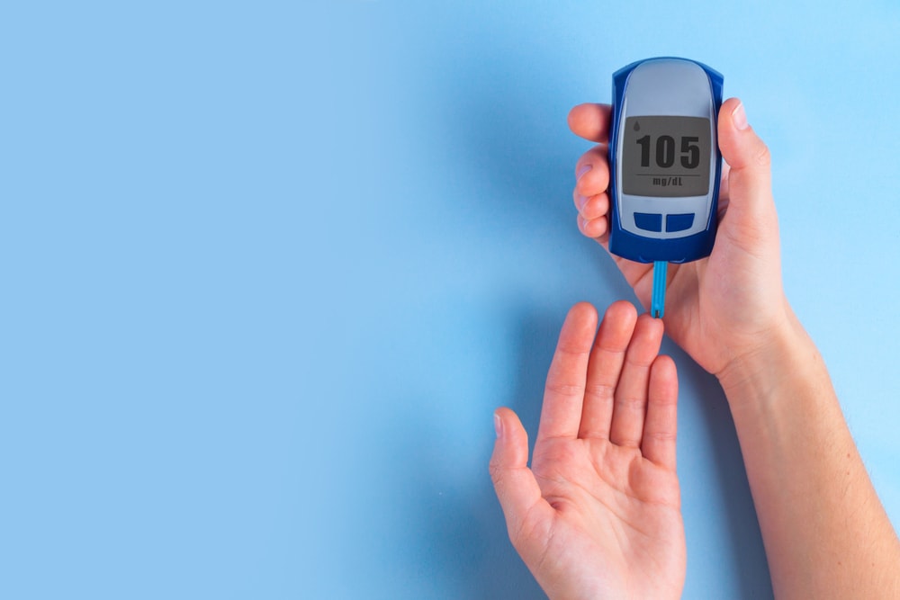 A person checks their blood sugar levels