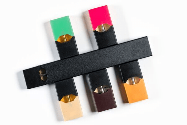 Examples of JUUL replacement pods and cartridges in Mango, Creme, Tobacco, and Mint